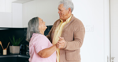 Buy stock photo Senior couple, dancing and happy in kitchen, love and house for fun, touch and romantic. Retirement, bonding together and smile for husband, wife and quality time with tango, retired and elderly
