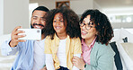 Happy family in selfie with kid in home, bonding together for love or memory on sofa. Photography, face and parents with girl child on couch in living room with smile, relax with mom and dad in house