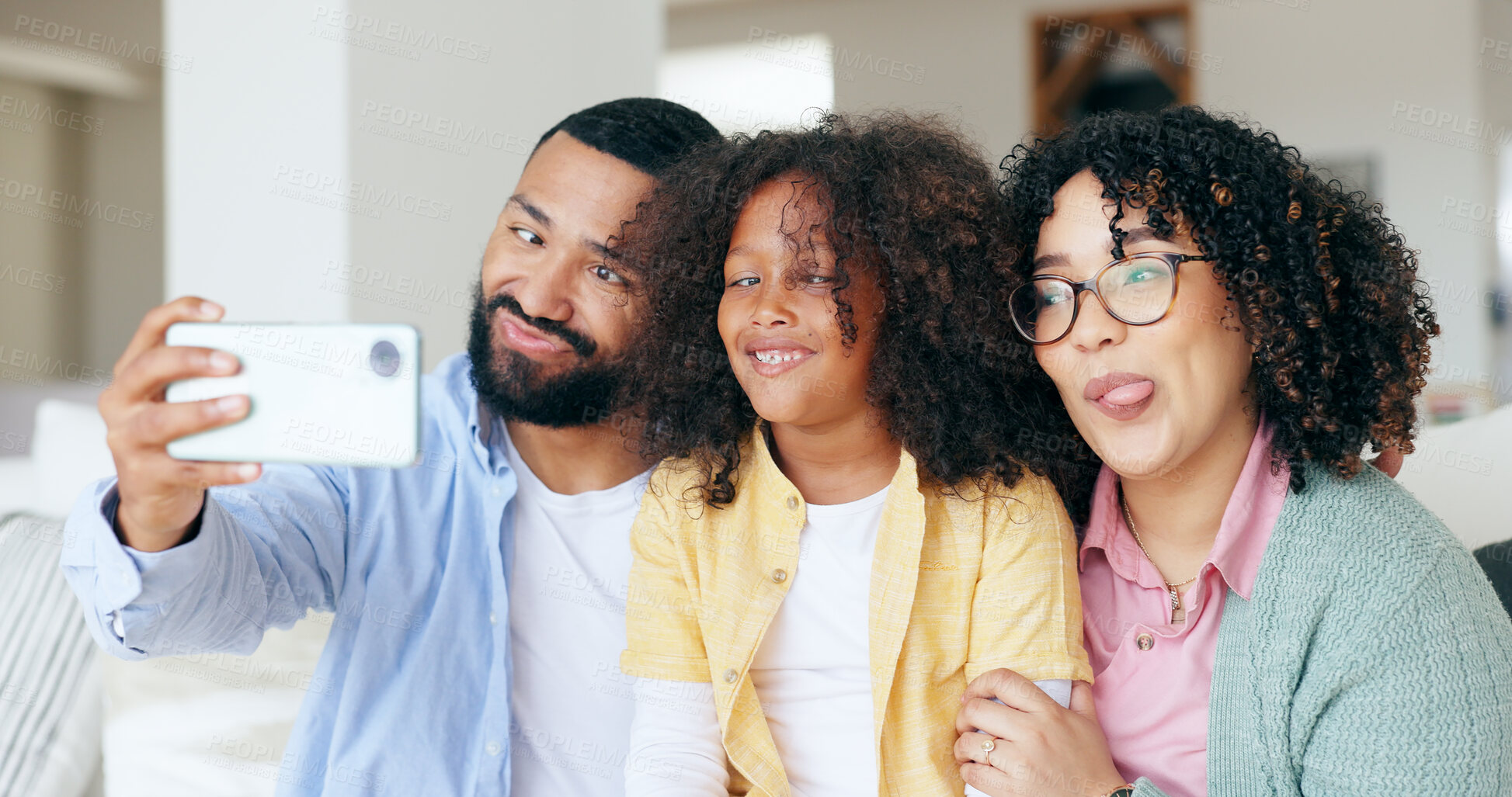 Buy stock photo Happy family in funny selfie with girl in home, bonding together for love and memory on sofa. Photography, crazy face and parents with child in living room with smile to relax with mom, dad and kid.