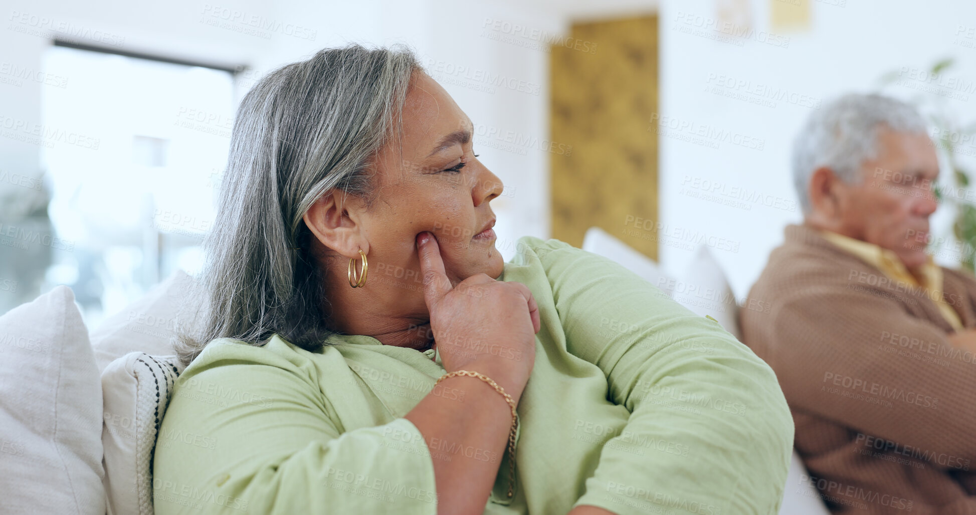 Buy stock photo Home, anxiety and old couple with divorce, argument and retirement with toxic relationship, bad marriage and conflict. Apartment, elderly woman or senior man on a couch, problems or drama with stress