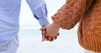 Buy stock photo Couple, holding hands and beach for love, care or support in trust, travel or outdoor getaway together. Closeup of man and woman touching in romance for unity, bonding or compassion on ocean coast