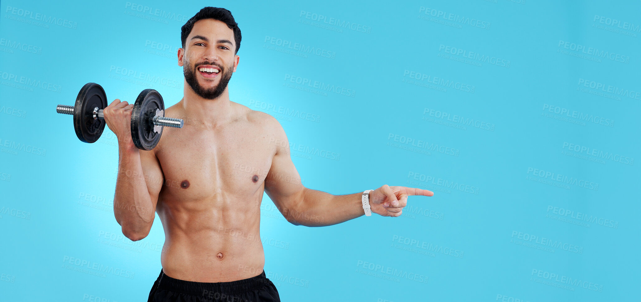 Buy stock photo Gym, portrait and happy man with dumbbell or hand pointing to studio for fitness, promo or info on blue background. Face, smile and male bodybuilder show sign up, presentation or membership offer