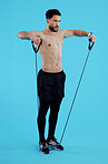 Fitness, stretching rope and man in studio for power workout, body building and building muscle strength. Exercise, sports and athlete on blue background with resistance training, gym and performance