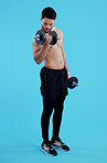 Fitness, dumbbells and man flex in studio for training, exercise or bodybuilding on blue background. Health, wellness or topless bodybuilder with bicep workout, muscle or body, progress or resilience