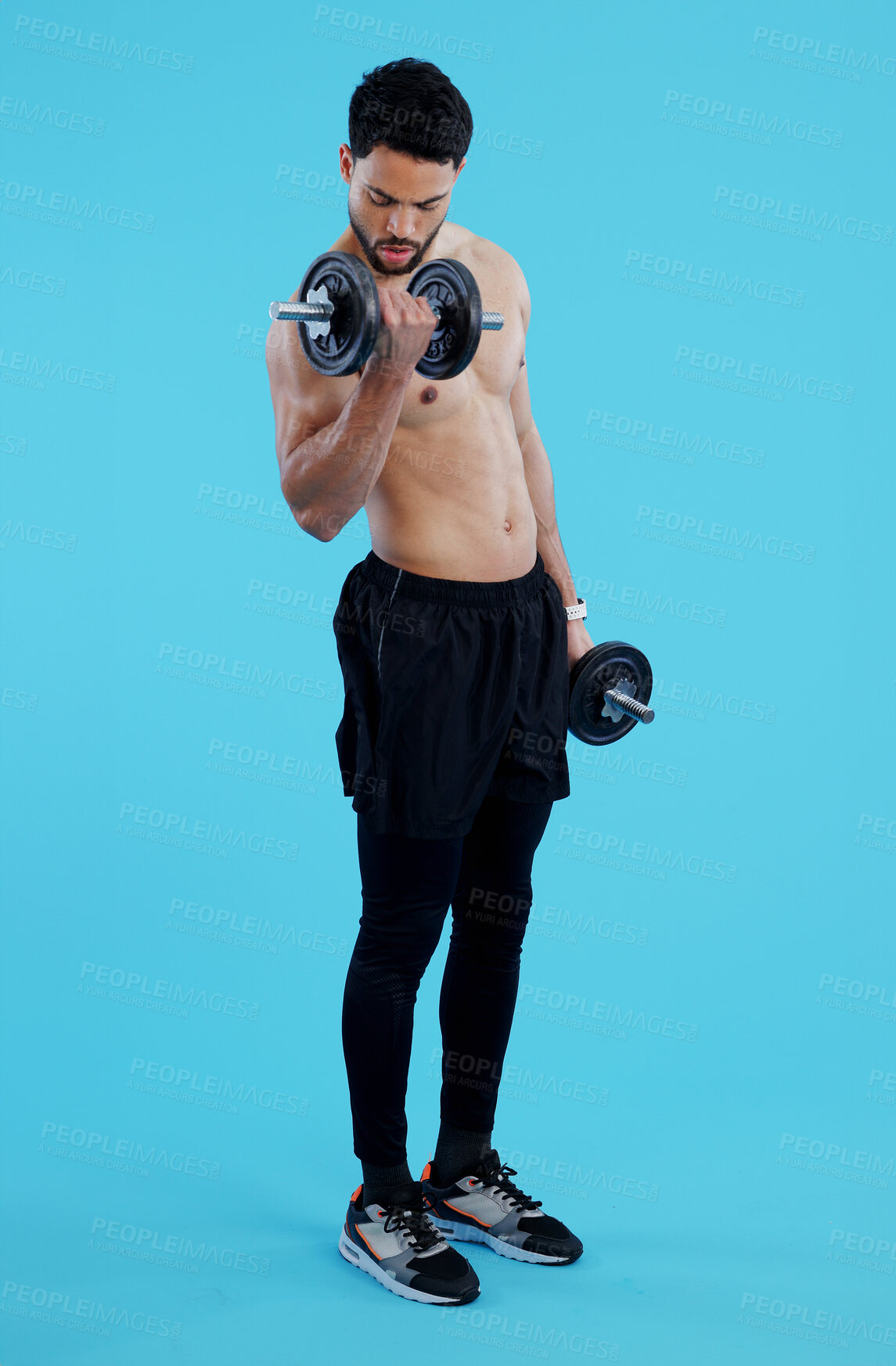 Buy stock photo Fitness, dumbbells and man flex in studio for training, exercise or bodybuilding on blue background. Health, wellness or topless bodybuilder with bicep workout, muscle or body, progress or resilience