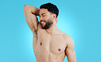 Happy man, armpit and smile for body hygiene, skincare or healthy wellness against a blue studio background. Male person or model in grooming, self care or fresh smell for clean skin on mockup space