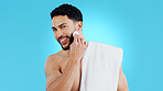 Skincare, portrait and happy man with cotton pad in studio for luxury, grooming or wellness on blue background. Face, smile and model with facial swab for cleaning, cosmetics or after shower beauty