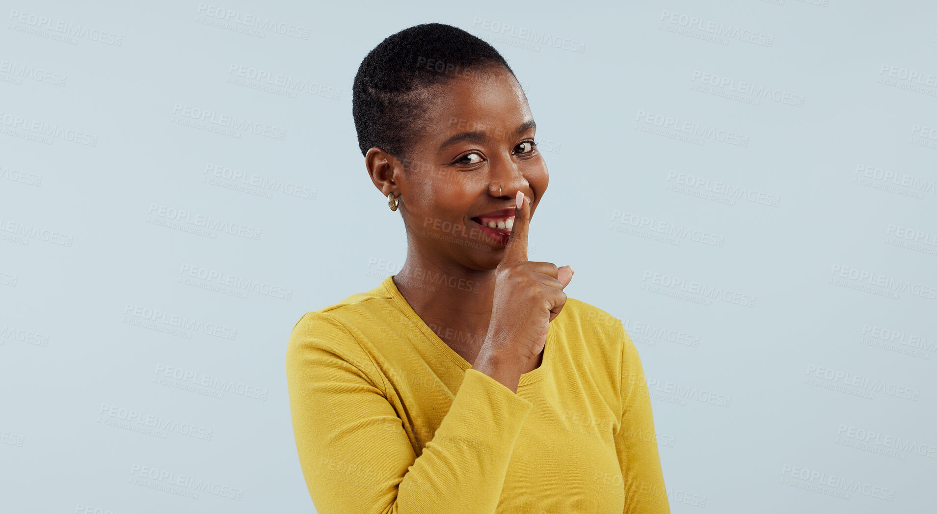 Buy stock photo Secret, portrait and happy black woman with finger on lips in studio for privacy, news or announcement on grey background. Gossip, whisper or model face with confidential hand, emoji or quiet gesture