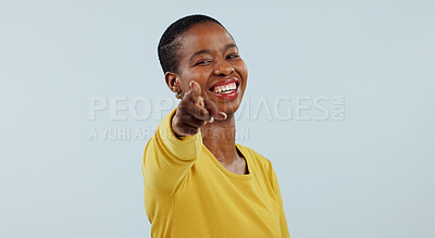 Buy stock photo Happy black woman, portrait and pointing to you for choice or selection against a gray studio background. Face of African female person or model smile with finger for decision, or choosing on mockup