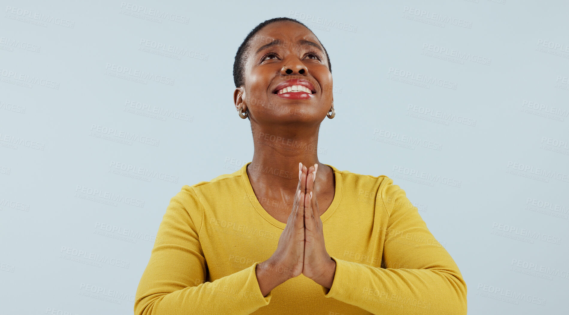 Buy stock photo Woman, praying hands and religion for hope, faith and asking god for help with spiritual support or opportunity in studio. Christian, African person and prayer emoji for forgive on a white background