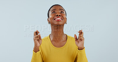 Buy stock photo Hope, wish and black woman in studio with fingers crossed for opportunity, deal or good news prayer. Praying hands, thinking and person with winning dream, confidence and faith on white background.