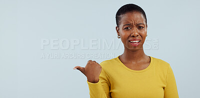 Buy stock photo Confused, pointing and portrait of black woman in studio with why, question and unsure. Emoji, what and face of person with hand gesture for announcement, information and news on blue background