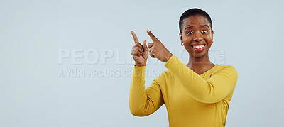 Buy stock photo Happy black woman, portrait and pointing up for surprise, advertising or marketing against a gray studio background. African female person smile in wow for deal promotion, sale or discount on mockup