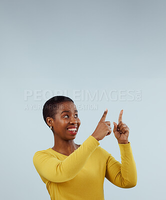 Buy stock photo Mockup, smile and black woman with hand pointing up in studio for presentation on grey background. News, announcement and African female model show feedback, checklist or schedule, promo or platform 