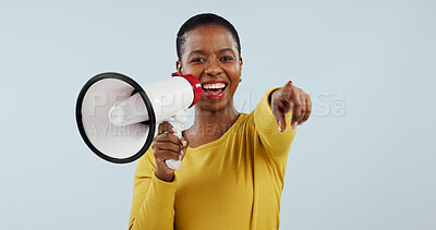 Buy stock photo Happy black woman, portrait and pointing to you with megaphone for choice against a gray studio background. African female person smile with loudspeaker or bullhorn for selection, choosing or sale