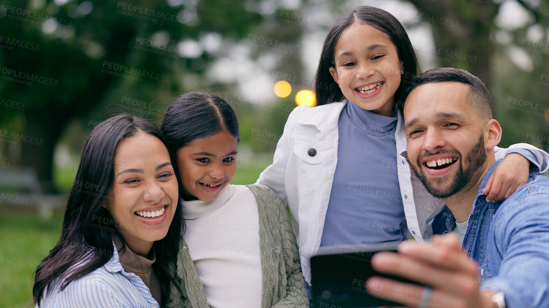 Buy stock photo Park selfie of mother, father and kids bonding on weekend in nature together for morning picnic. Photography, fun and memory for happy family with mom, dad and children in garden with smile and hug.