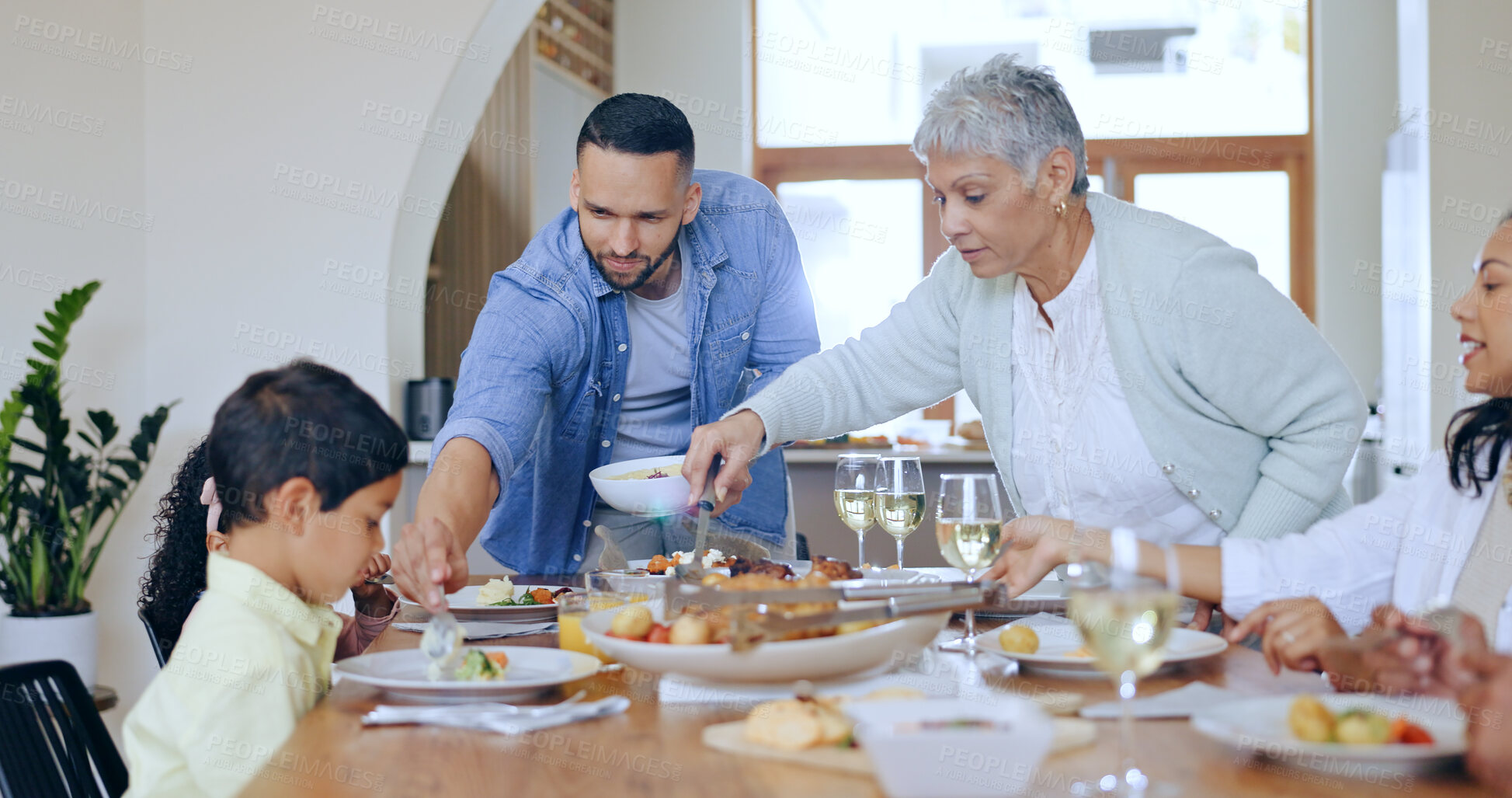 Buy stock photo Home, feast and family with lunch, food and happiness with holiday, bonding together and conversation. Group of people, apartment and generations with love, thanksgiving meal and festive celebration