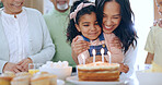 Child with birthday cake, candles and family to celebrate with smile, fun and love together in home. Happiness, gift and congratulations, mom and grandparents at kids party with excited children.