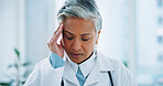 Doctor, woman or headache in office with burnout, stress and risk at hospital or clinic from migraine. Mature person, employee or professional with wellness, anxiety or discomfort from strain at work