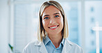 Portrait, woman and doctor in hospital with smile, integrity and professional healthcare. Face, happy and confident medical expert, worker and employee consulting with trust, pride and help in clinic