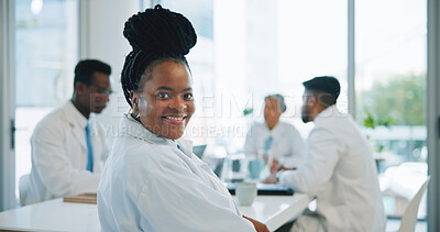 Portrait, black woman and doctors in a meeting, smile and healthcare with planning, hospital and teamwork. Face, professional and group with management staff, conversation and talking with medicare