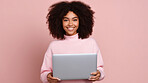 Happy, woman and portrait of a young girl holding a laptop, for remote working, online education or business. Confident, African American female posing against a pink background in studio