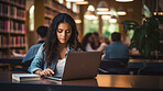 Student, female and portrait of a young girl working, doing an assignment or researching on a laptop in a school or college library. Confident, Indian, female teen doing homework in an information centre