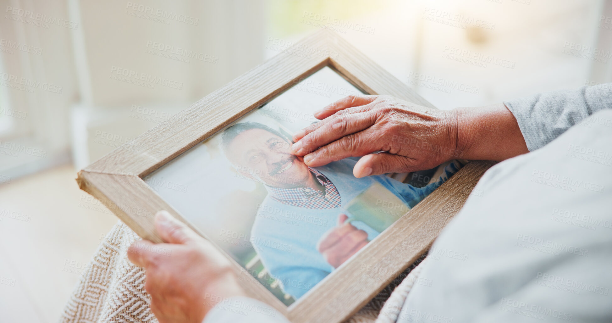 Buy stock photo Senior woman, grief and picture of husband on lap, hands and sad of love loss in retirement. Elderly person, alone and dear memory of beloved with anxiety, mental health and lonely bereaved in house