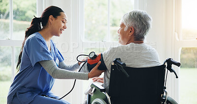 Buy stock photo Woman, caregiver and senior in wheelchair for blood pressure, monitoring or elderly care at old age home. Nurse or medical doctor checking BPM of mature patient or person with a disability at house