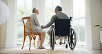 Man, wheelchair and woman comfort in home for relationship bonding, love trust or helping hand. Wife, and husband with a disability together in morning or retirement relax, care compassion or support