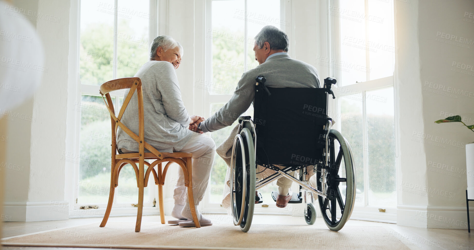 Buy stock photo Man, wheelchair and woman comfort in home for relationship bonding, love trust or helping hand. Wife, and husband with a disability together in morning or retirement relax, care compassion or support