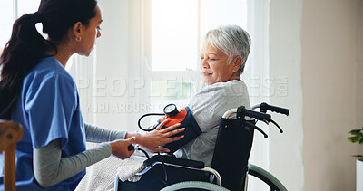 Buy stock photo Woman, nurse and senior in wheelchair for blood pressure, monitoring or elderly care at old age home. Doctor or medical caregiver checking BPM of mature patient or person with a disability at house