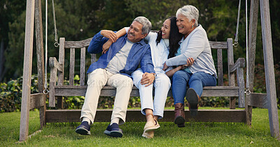 Buy stock photo Senior parents, hug or woman on bench with laughing, nature or bonding with goofy on retirement. Mature man, mother or older daughter for together in comic joke, lounge or embrace for love in garden 