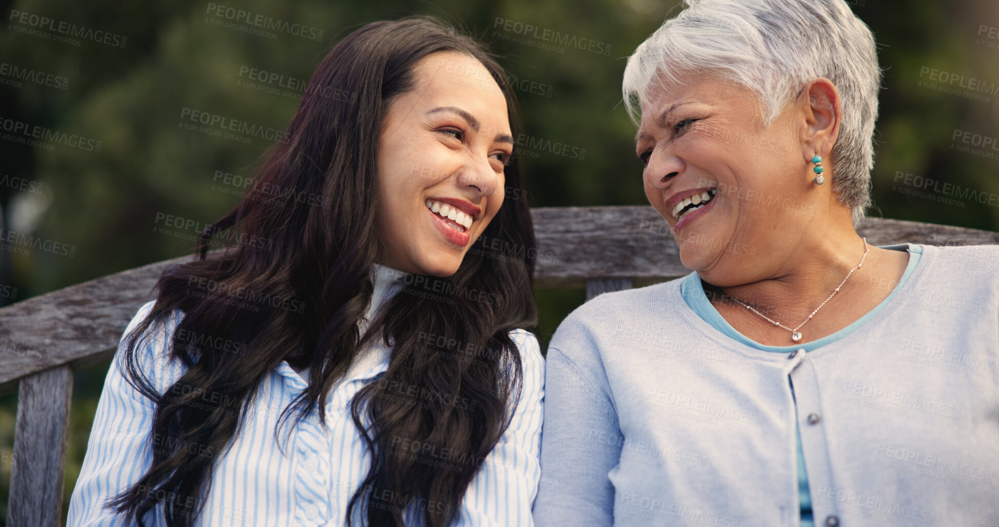 Buy stock photo Happy, mature and mother with woman on bench, nature and bonding for laugh on retirement. Senior person, parent and older daughter for leisure together in park, care and love for funny joke in garden