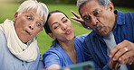 Selfie, peace sign or funny face with a nurse and old couple outdoor in an assisted living garden together. Love, support or wellness with a senior man, woman and young caregiver in the backyard