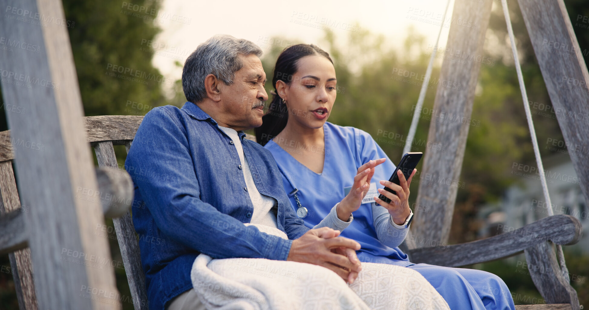 Buy stock photo Outdoor, bench and nurse with old man, smartphone and connection with social media, discussion and internet. Pensioner, outdoor and caregiver with elderly person, cellphone and typing with email