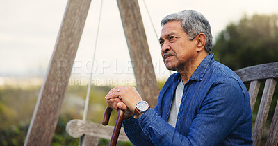 Buy stock photo Senior, man or thinking with cane for retirement, alzheimer and memory outdoor on bench and lonely. Elderly, person or walking stick with nostalgia, thoughtful and peace in nature or park with wonder