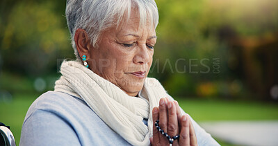 Buy stock photo Senior woman, praying hands or rosary in wheelchair in nature, faith or hope in retirement. Mature person, catholic or meditation or praise to god, garden or petition as intercessor for jesus christ