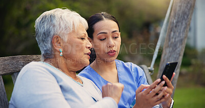 Buy stock photo Outdoor, bench and nurse with old woman, smartphone and connection with social media, conversation and internet. Pensioner, outdoor and caregiver with elderly person, cellphone and typing with email