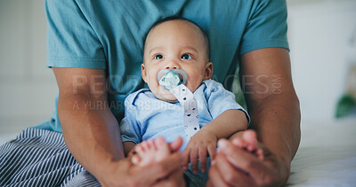 Buy stock photo Family, love and father with baby on a bed for bond, comfort and playing in their home together. Support, care and parent with curious infant son in a bedroom for learning, hug or security in a house