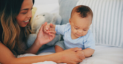 Buy stock photo Family, love and a mother on the bed with her baby in their home together for care or bonding. Children, smile and a happy young woman in the bedroom of an apartment with her adorable infant son