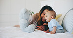 Happy, mom and baby with teddy bear in bedroom or home with love, care and support in morning. Newborn, child and mother smile together and bonding with toys, fun or kid laughing on bed in house