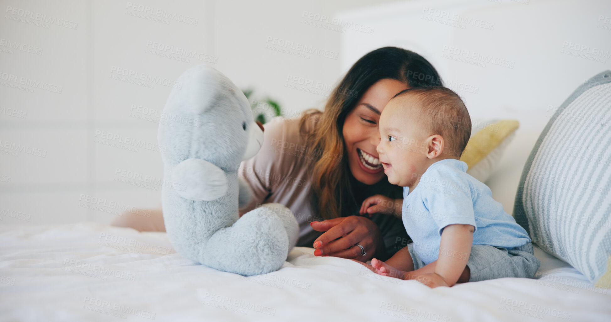 Buy stock photo Happy, mom and baby with teddy bear in bedroom or home with love, care and support in morning. Newborn, child and mother smile together and bonding with toys, fun or kid laughing on bed in house