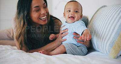 Buy stock photo Family, smile and a mother on the bed with her baby in their home together for care or bonding. Children, love and a happy young woman in the bedroom of an apartment with her adorable infant son