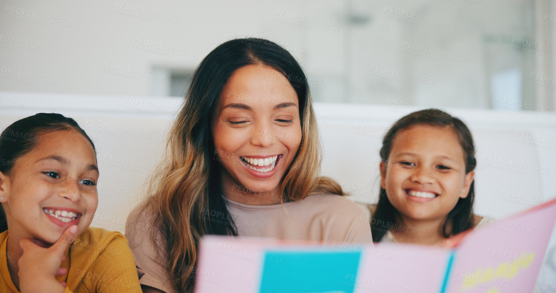 Buy stock photo Happy, book and children reading with mom in living room and relaxing together at home. Smile, bonding and girl kids enjoying a story or fantasy novel with young mother in the lounge of modern house.