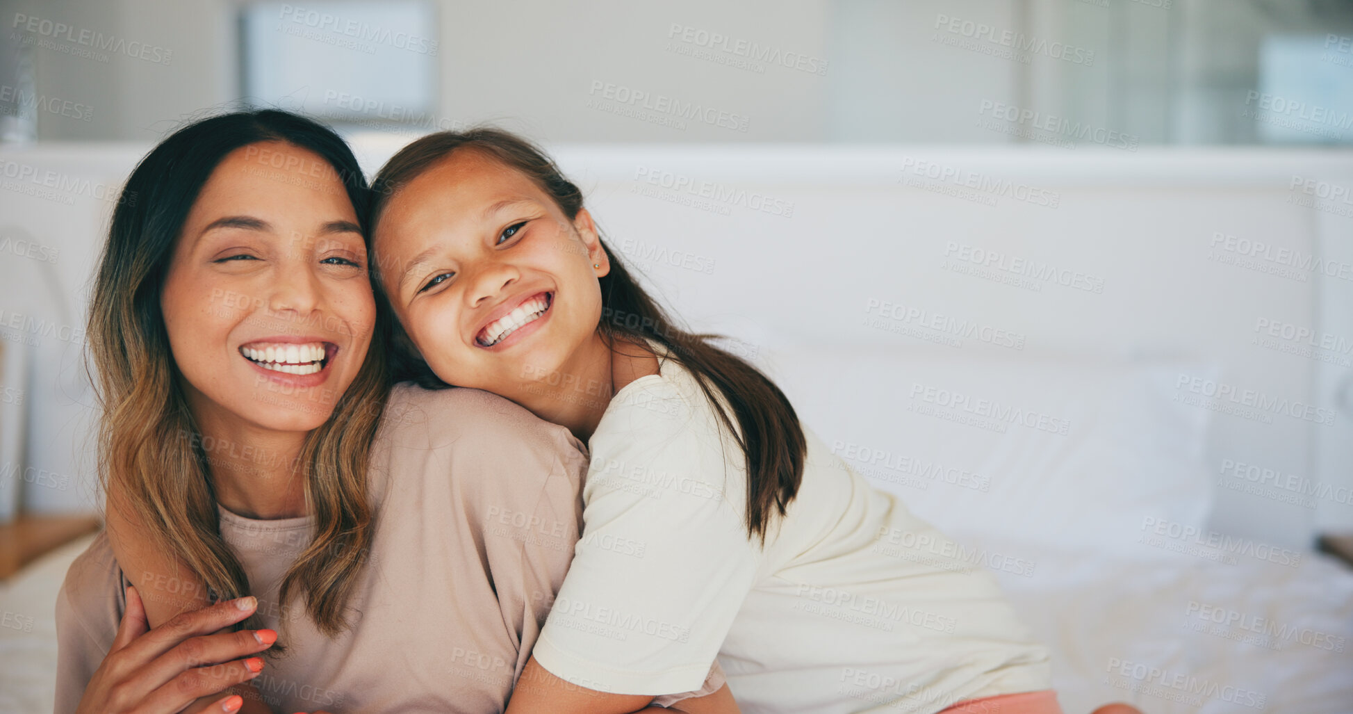 Buy stock photo Portrait, family and a mother hugging her daughter in the bedroom of a home in the morning together. Face, smile and a happy young girl embracing her single parent while on a bed in their apartment