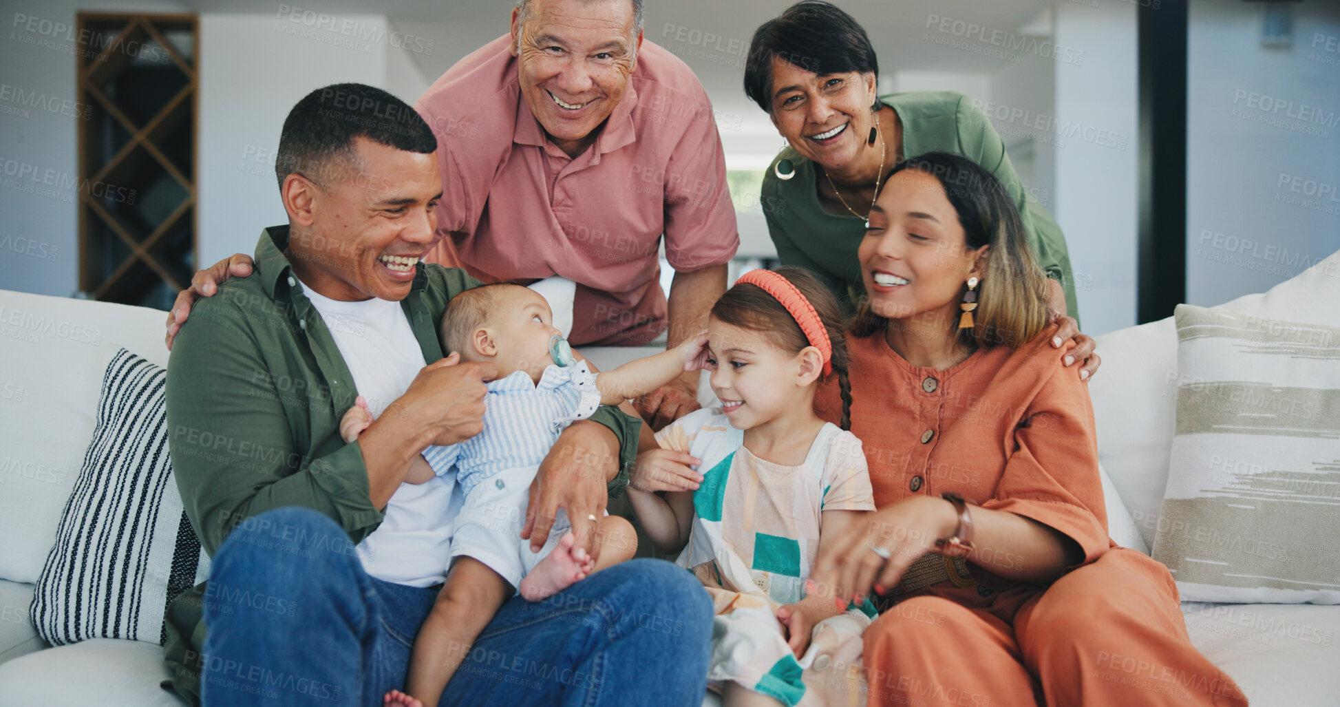 Buy stock photo Happy, smile and big family playing on sofa in the living room at modern home together. Bonding, love and young kids relaxing with parents and grandparents for generations in the lounge at house.
