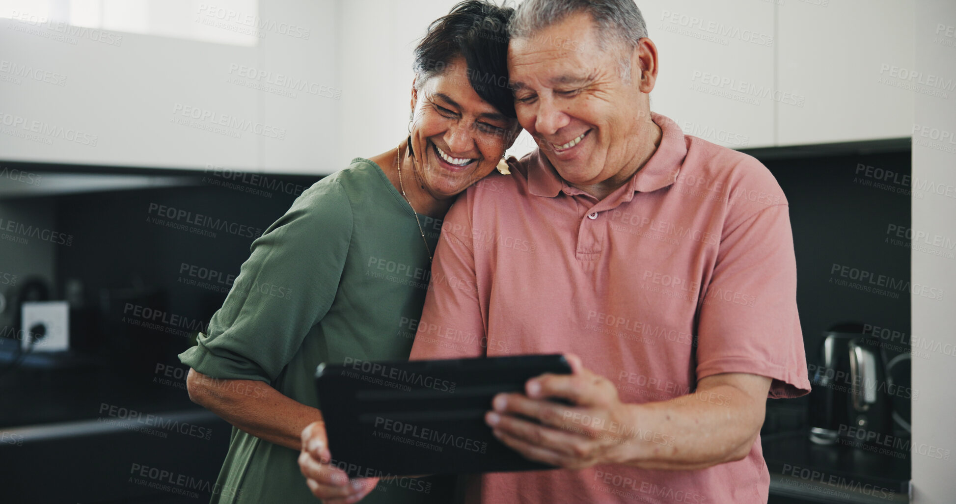 Buy stock photo Senior couple, tablet and video call for social conversation, kitchen and lunch time. Grandparents, technology and communication with family, man and woman in retirement, happiness and connection
