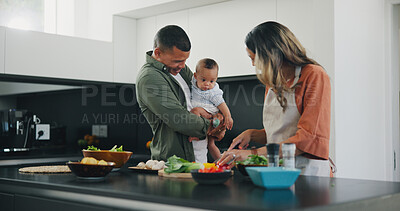 Buy stock photo Happy, couple and baby cooking vegetables in kitchen for nutrition food, child development or parent connection. Man, woman and boy in home for meal prepare or health wellness, ingredients for dinner