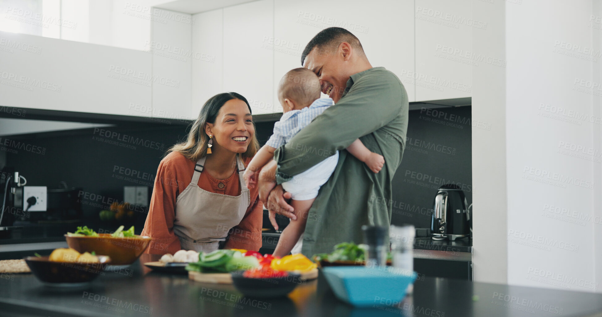 Buy stock photo Family, smile and play in kitchen, love and bonding or fun, relax and support or laughing at home. Happy parents and baby, connect and humor or cooking, nutrition and healthy food or care for child